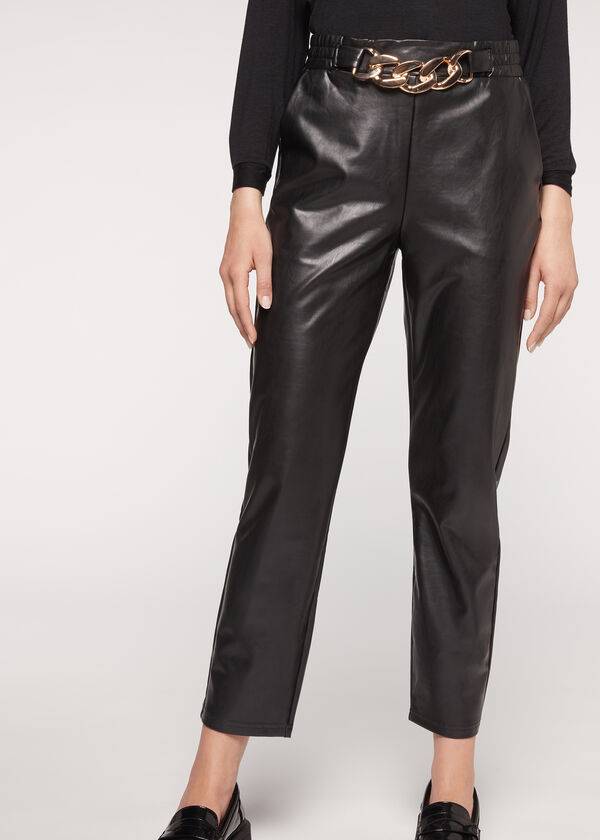 schwarze damen-hose von calzedonia mit thermobeschichtung und kettenbesatz