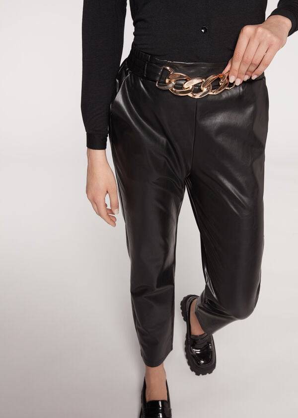 schwarze damen-hose von calzedonia mit thermobeschichtung und kettenbesatz